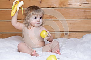 Solid food for infant. Kid with fresh fruit apple and banana. Fresh vegetables and fruits.