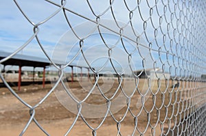 Solid metallic mesh fence closeup