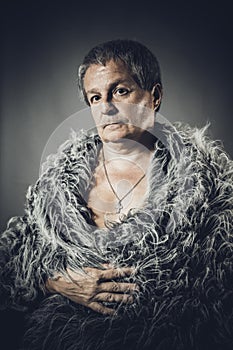 Solid middle-aged man in a fur mantle