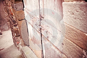 Solid old door blocked by a fence, security concepts protection