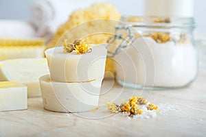 Solid shampoo bar many and handmade soap round bars with herbs dry marigold flowers. Spa bathroom products aroma salt