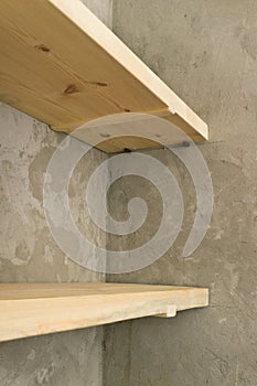 Solid shelves made of wood in the pantry