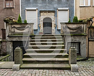 Solid stone steps to door of old house in Gdansk