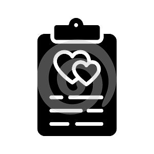 A solid style icon denoting wedding vows paper