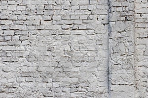 Solid wall with white bricks in vintage style as grey stonewall background or wallpaper with urban house architecture seamless age