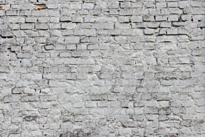 Solid wall with white bricks in vintage style as grey stonewall background or wallpaper with urban house architecture seamless age