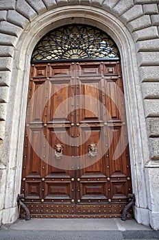 Solid wooden door - Rome, landmark attraction in Italy. Wooden background