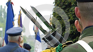 Solider holding gun at parade in France