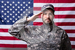 Solider Saluting Against The American Flag