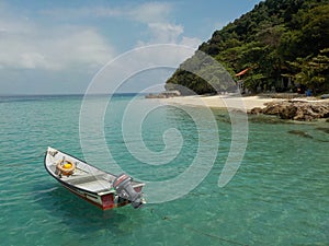 Solitary boat in emerald waters, Pulau Kapas Island