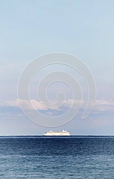 Solitary cruise ship in the ocean, dreamy