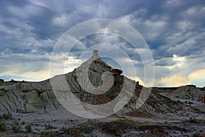 Dinosaur Provincial Park, Solitary Hoodoo with Prairie Thunderstorm brewing Overhead, Alberta, Canada