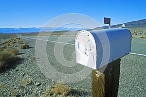 Solitary mailbox by side of highway, Sierras, CA