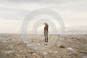 Solitary man looks at the infinite in a surreal and spectacular landscape