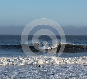 A Solitary Surfer Appraoches the Waves