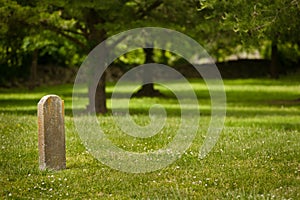 Solitary tombstome in Cemetary photo