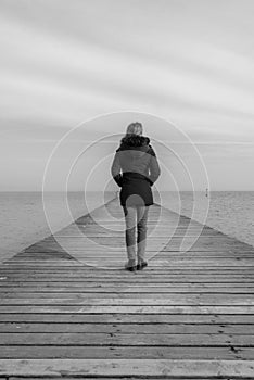 Solitary woman in front of sea