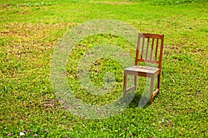 Solitude of a chair on the grass
