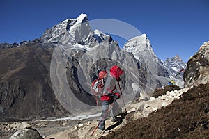 Solitude lady trekking in Himalayas region