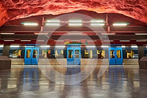 Solna centrum Stockholm metro station with train on platform.