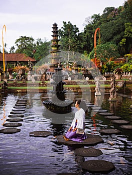 Solo Female Traveler Admiring Main fountain at Tirta Gangga, Bali