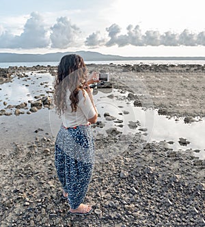 Solo Girl Traveller, a trendsetter in her 20s, wearing Ethnic Indian Dress with Polka dots is travelling solo and exploring nature