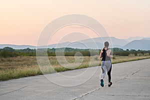 Solo Stride: Determined Athlete Woman Embarks on Fitness Journey for Marathon Preparation.