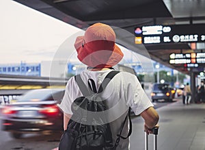 Solo traveler carry luggage walking in airport