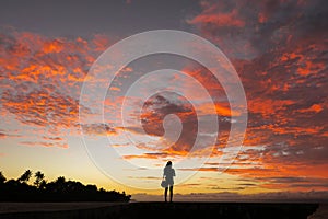 Solo Traveler Woman and Incredible Island Sunset