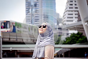 Solo Travellers. Muslim women. Portrait of stylish muslim woman in city