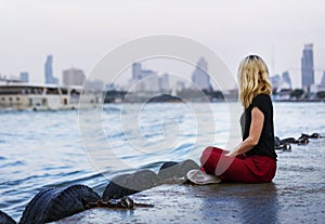 Solo woman traveler near the river