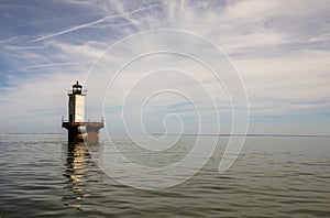 Solomons Lump Lighthouse reflecting in Chesapeake Bay landscape