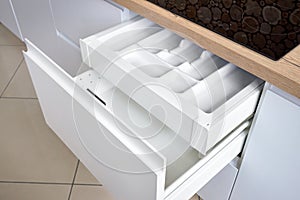 Solution for placing kitchen utensils in modern kitchen - horizontal sliding pullout drawer shelves storage in cupboard for