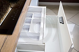 Solution for placing kitchen utensils in modern kitchen - horizontal sliding pullout drawer shelves storage in cupboard for