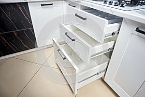 Solution for placing kitchen utensils in modern kitchen - horizontal sliding pullout drawer shelves storage in cupboard for