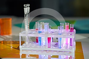 Solution in a scientific glass flask against the background of a school chemistry laboratory. Chemical laboratory