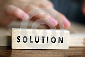 Solution single word for business solution concept printed on wooden block.