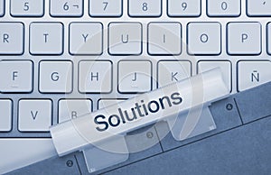 Solutions - Inscription on Blue Keyboard Key