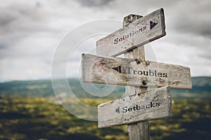 Solutions, troubles and setbacks signpost.