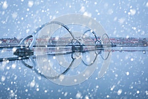 Solvesborgsbron pedestrian bridge with falling snow in the south of Sweden