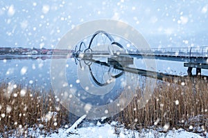 Solvesborgsbron pedestrian bridge with falling snow in the south of Sweden