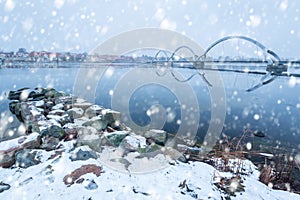 Solvesborgsbron pedestrian bridge with falling snow in the south of Sweden