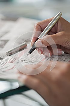 Solving a crossword puzzle close-up