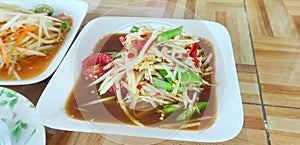 Som Tum Pu Pla Ra (Spicy Papaya Salad with Salted Crab and a pungent dressing based on fermented anchovy sauce)