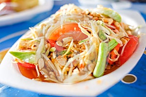 Som Tum Thai or Green Papaya Salad serve on styrofoam plate at P