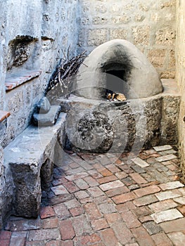 Somber kitchen with vintage oven in Santa Catalina monastery, Arequipa, Peru