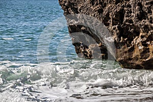 Waves on the rocky coast at Sombrio Beach photo