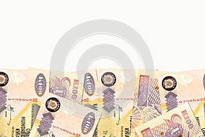 Some 100 zambia kwacha bank notes with copyspace above on white background