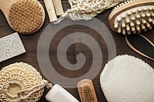 Some bath accessories on brown wooden background