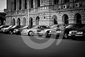 Some beautiful Mercedes stand in a row on the parking.